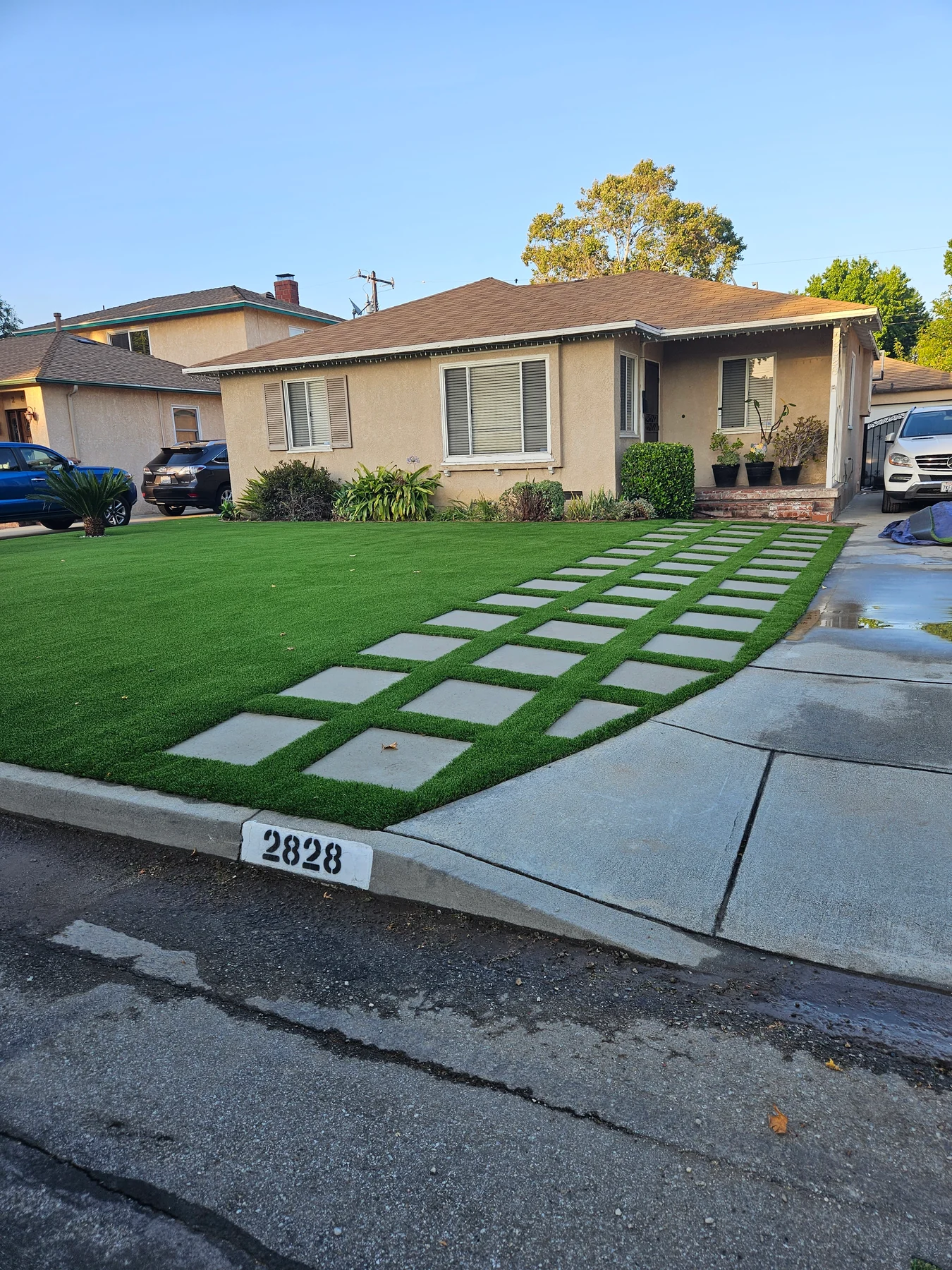 CSC Turf front-yard project with artificial turf and concrete stepping stones
